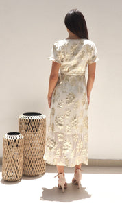 Female model wearing Yasmin Gold Wrap Dress - Cream / Gold- showcasing the latest ladies fashion with free delivery