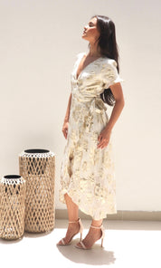 Female model wearing Yasmin Gold Wrap Dress - Cream / Gold- showcasing the latest ladies fashion with free delivery