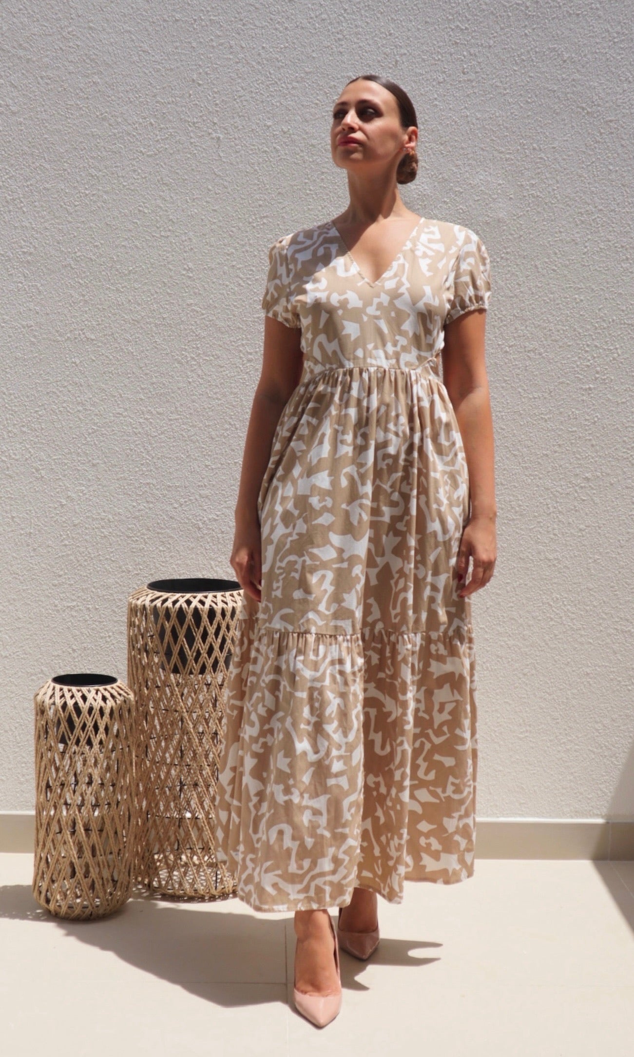 Female model wearing Savanna Open Back Dress - Beige- showcasing the latest ladies fashion with free delivery