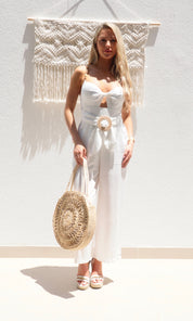 Female model wearing Rosie Circular Straw Bag - Natural- showcasing the latest ladies fashion with free delivery