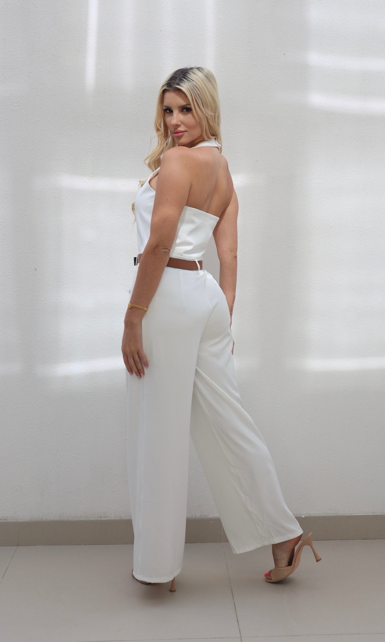 Female model wearing Celine halter neck Jumpsuit - White- showcasing the latest ladies fashion with free delivery