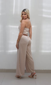 Female model wearing Celine halter neck Jumpsuit - Beige- showcasing the latest ladies fashion with free delivery