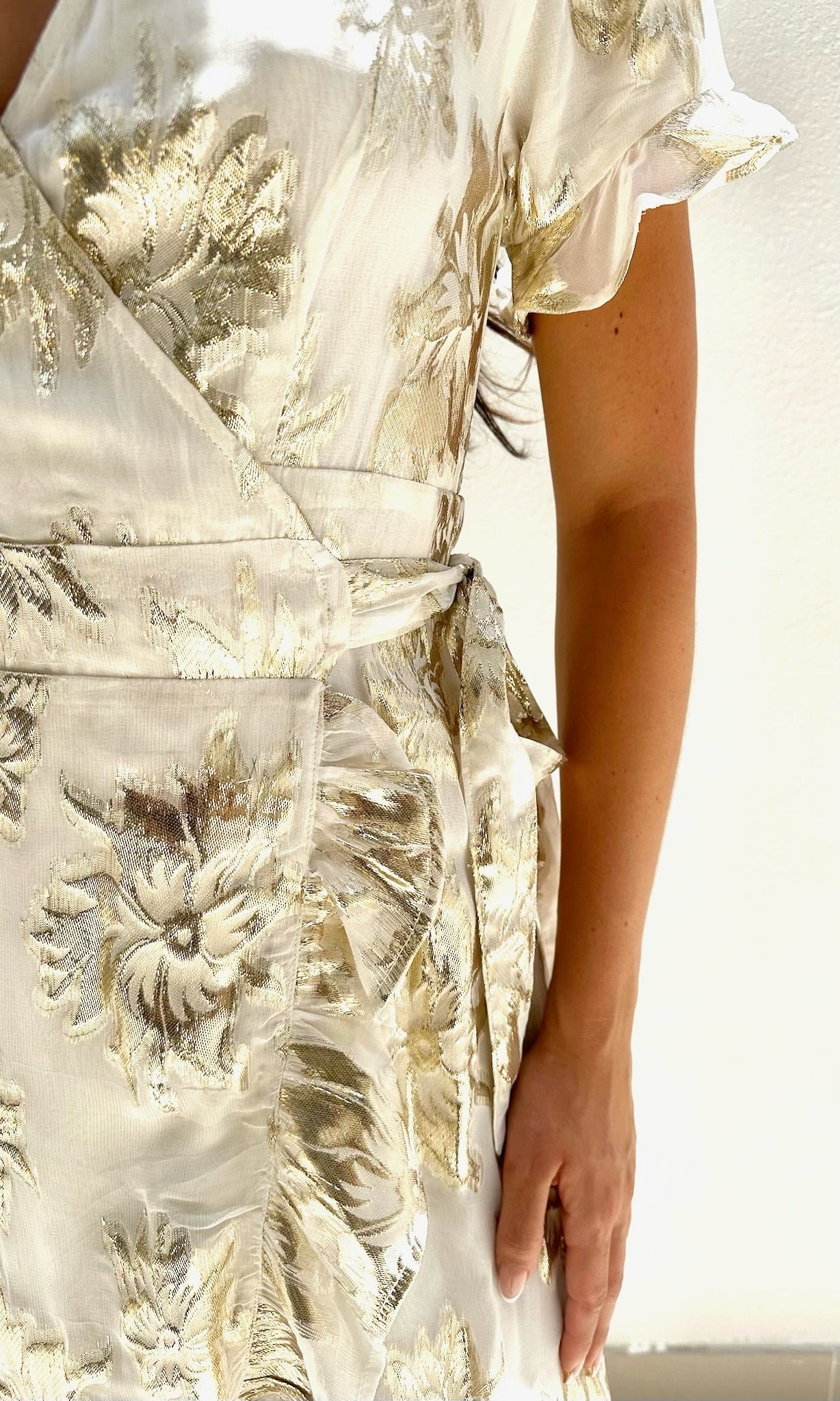 Female model wearing Yasmin Gold Wrap Dress - Cream / Gold- showcasing the latest ladies fashion with free delivery