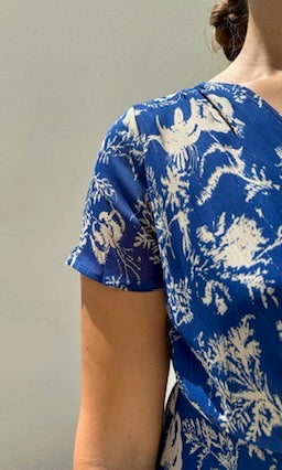 Female model wearing Madeline Wrap Frill Dress - Royal Blue- showcasing the latest ladies fashion with free delivery 