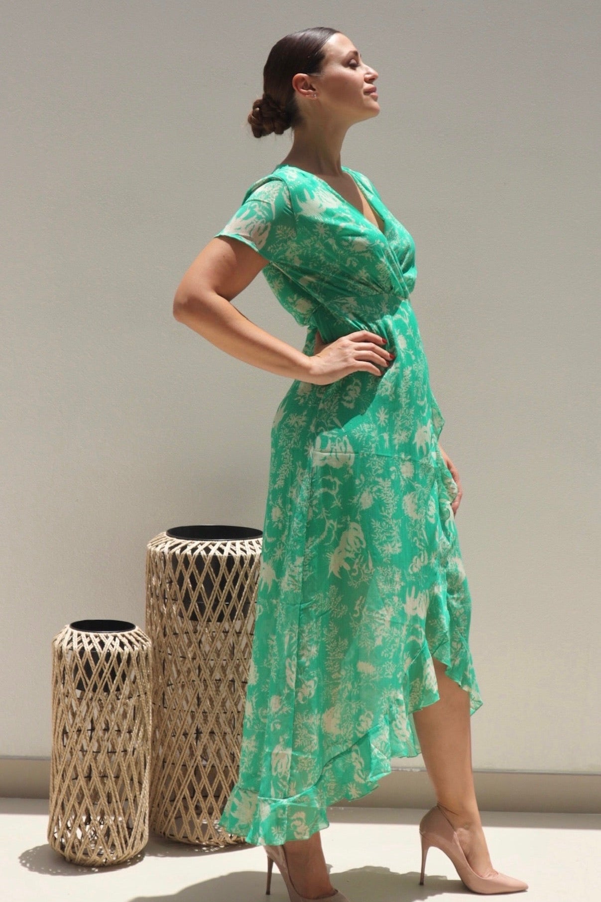 Female model wearing Madeline Wrap Frill Dress - Green- showcasing the latest ladies fashion with free delivery 