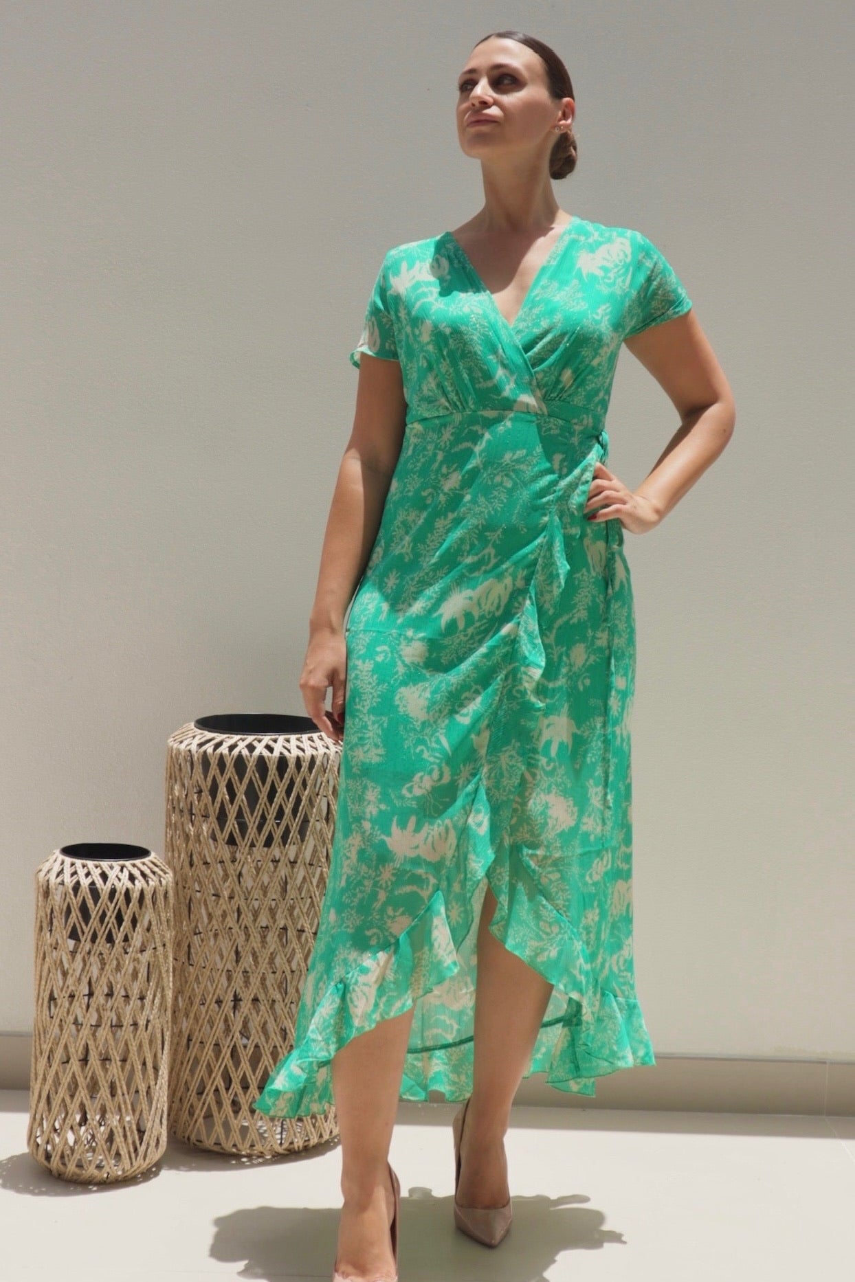Female model wearing Madeline Wrap Frill Dress - Green- showcasing the latest ladies fashion with free delivery 