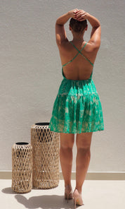 Female model wearing Nikita Cross Back Dress - Green- showcasing the latest ladies fashion with free delivery 