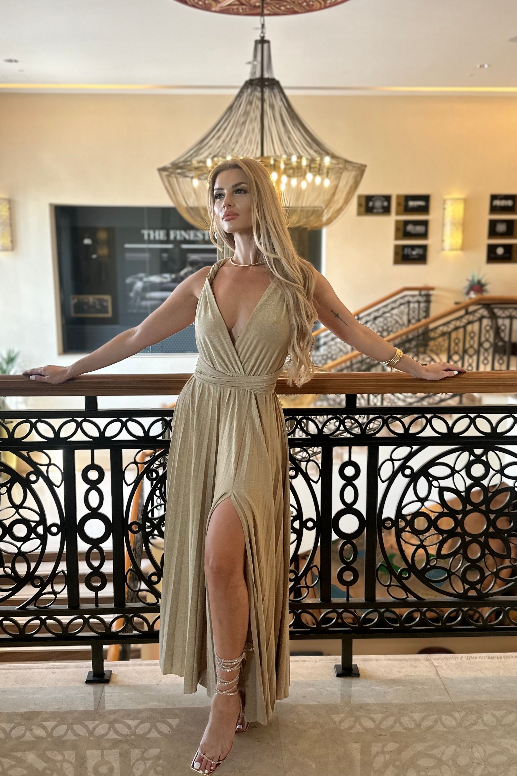 Female model wearing Whitney Infinity Maxi Dress - Gold- showcasing the latest ladies fashion with free delivery 