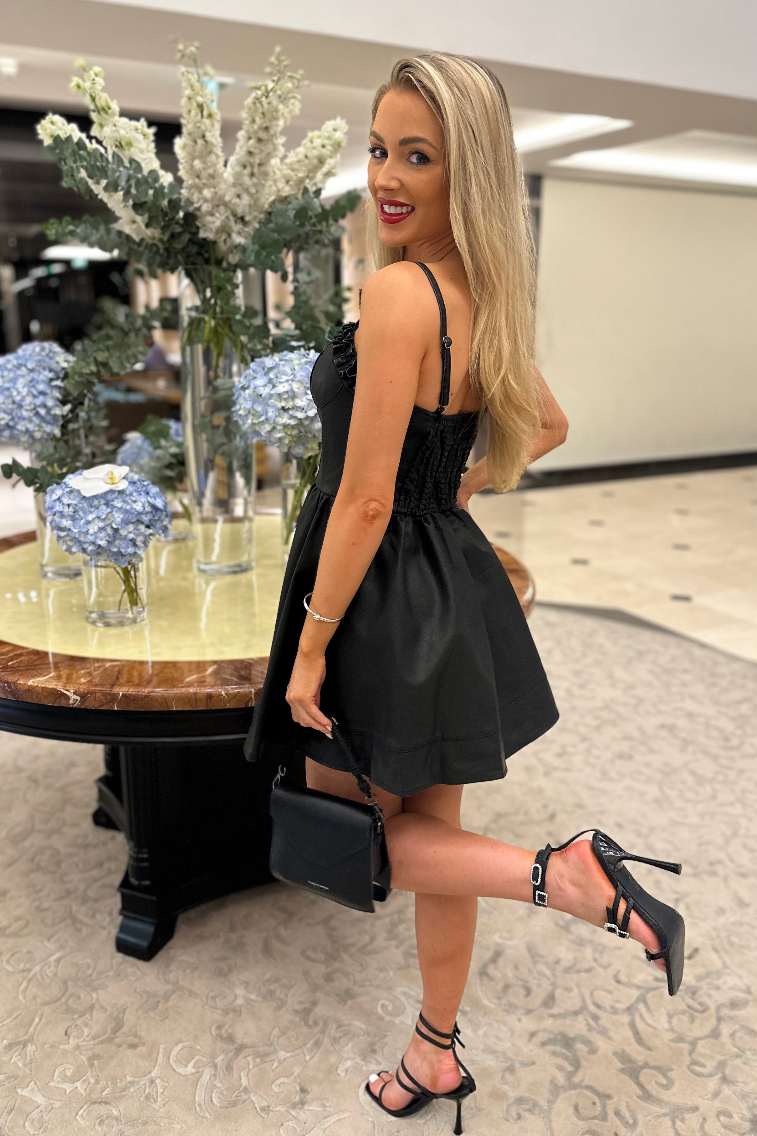 Female model wearing Dakota Leather Look Dress - Black- showcasing the latest ladies fashion with free delivery 