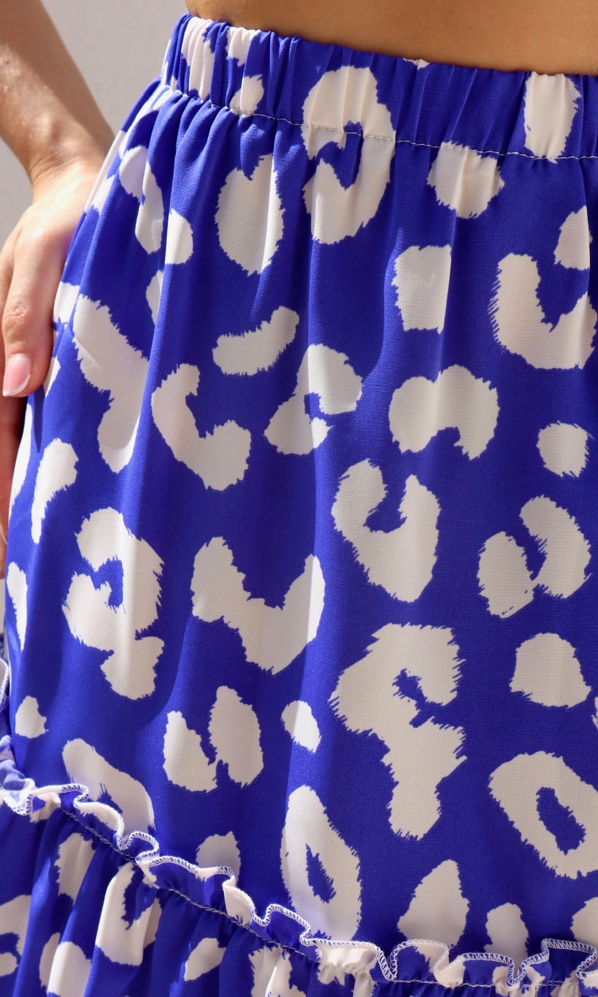 Female model wearing Aria Bold Leopard Print Mini Skirt - Royal Blue- showcasing the latest ladies fashion with free delivery 