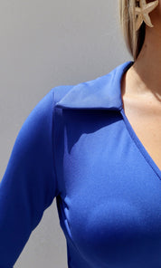 Female model wearing Penelope Wrap Over Collar Top - Royal Blue- showcasing the latest ladies fashion with free delivery 