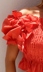Female model wearing Jasmine Ruched Ruffle Top - Orange- showcasing the latest ladies fashion with free delivery 