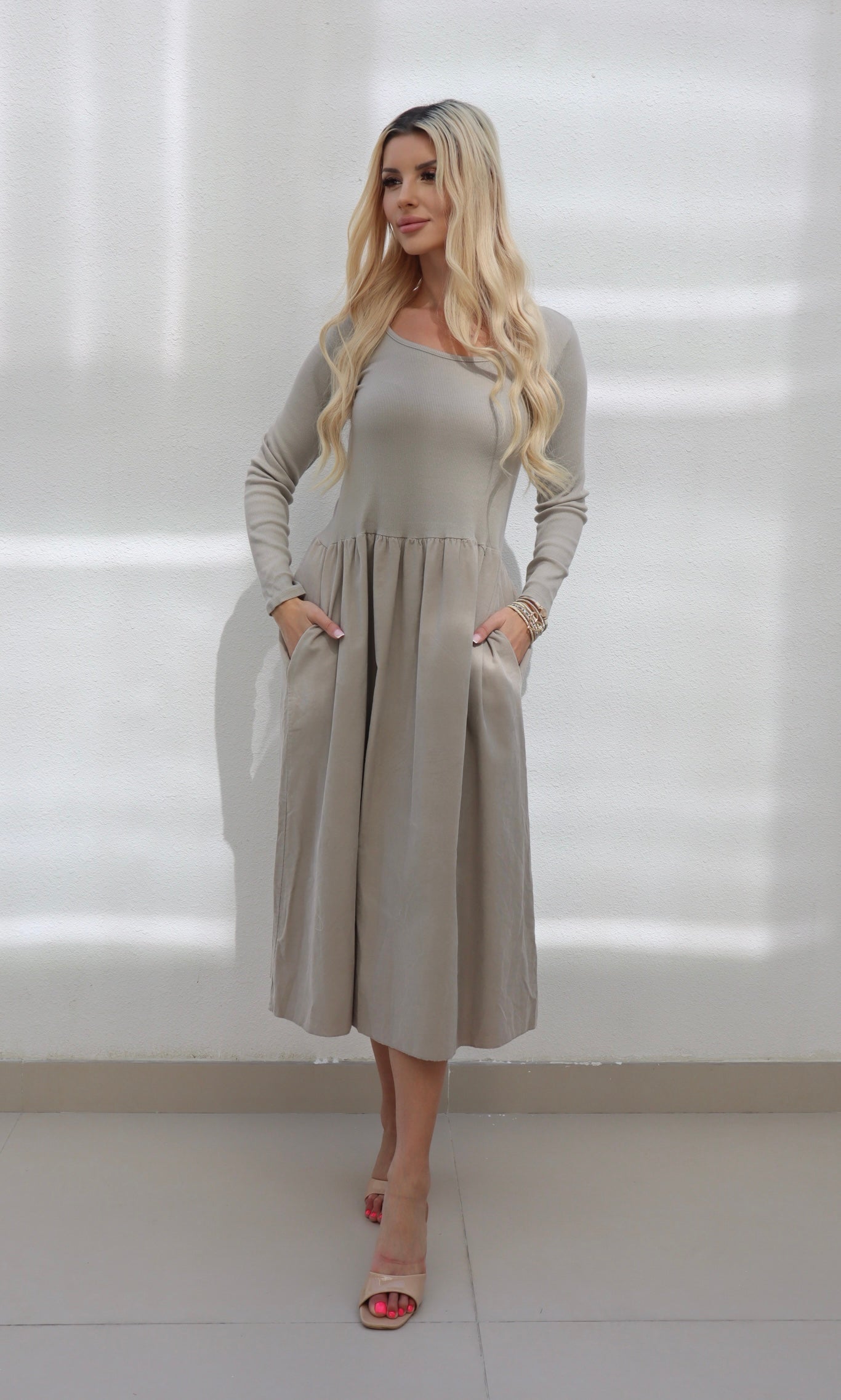 Female model wearing Shyla cord Dress - Stone- showcasing the latest ladies fashion with free delivery 