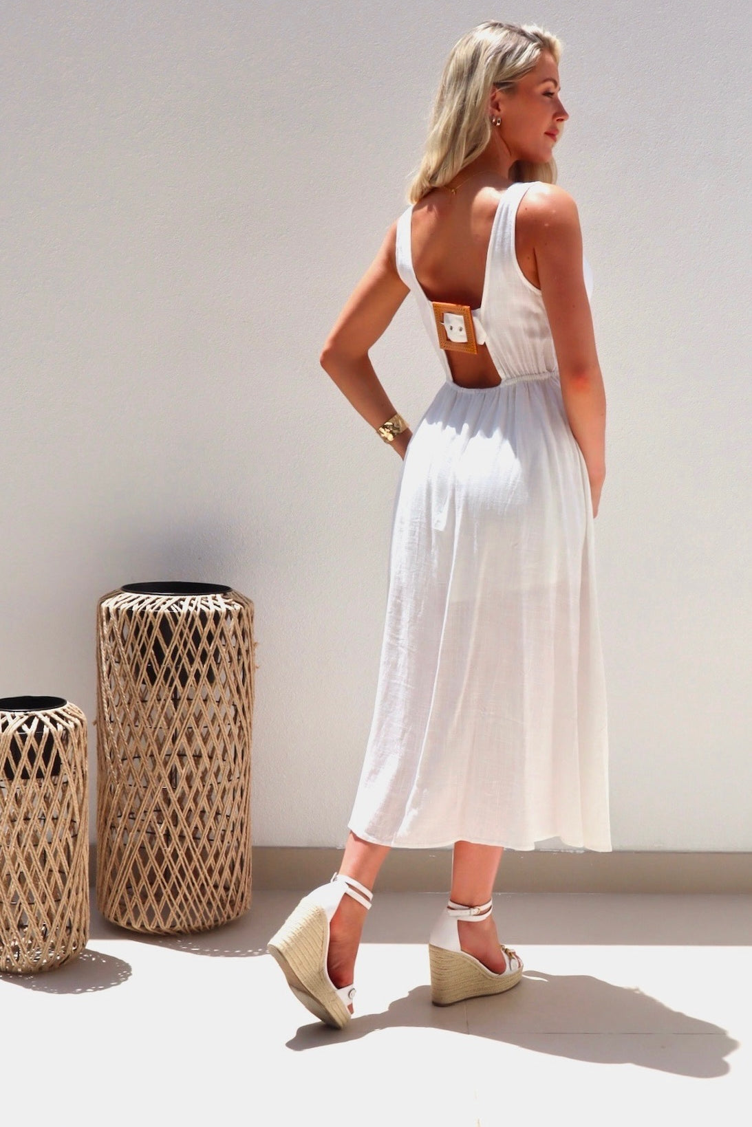 Female model wearing Catalina Button Dress - White- showcasing the latest ladies fashion with free delivery 