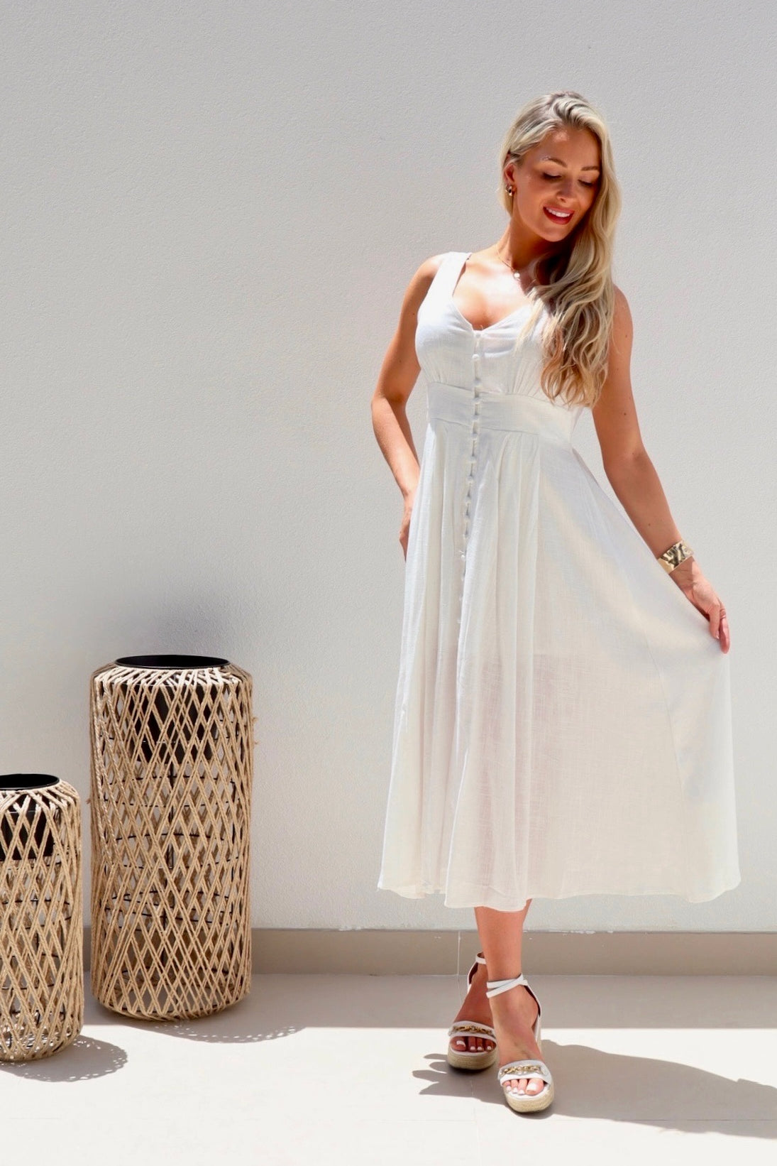 Female model wearing Catalina Button Dress - White- showcasing the latest ladies fashion with free delivery 